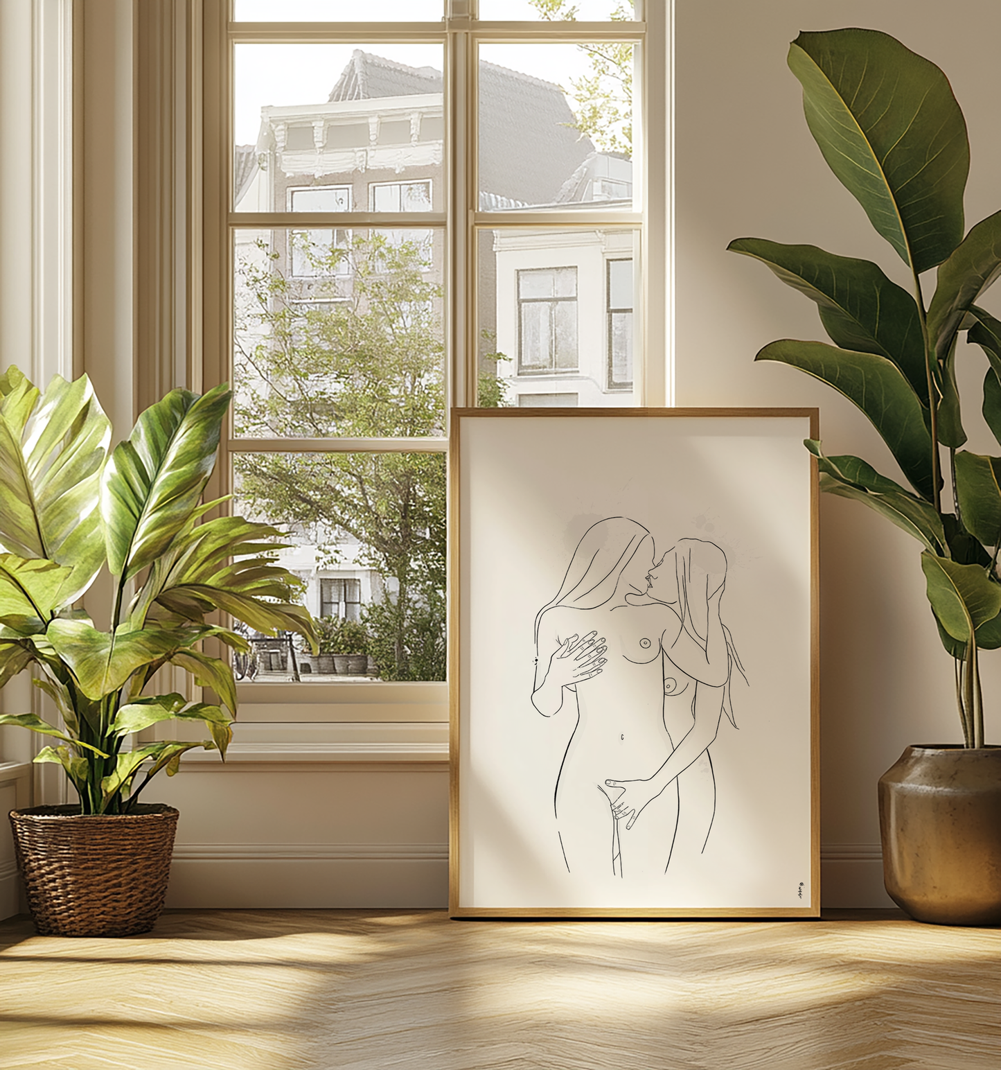 Mockup displaying erotic art of 2 nude women, in natural wooden frame in loft with lots of plants