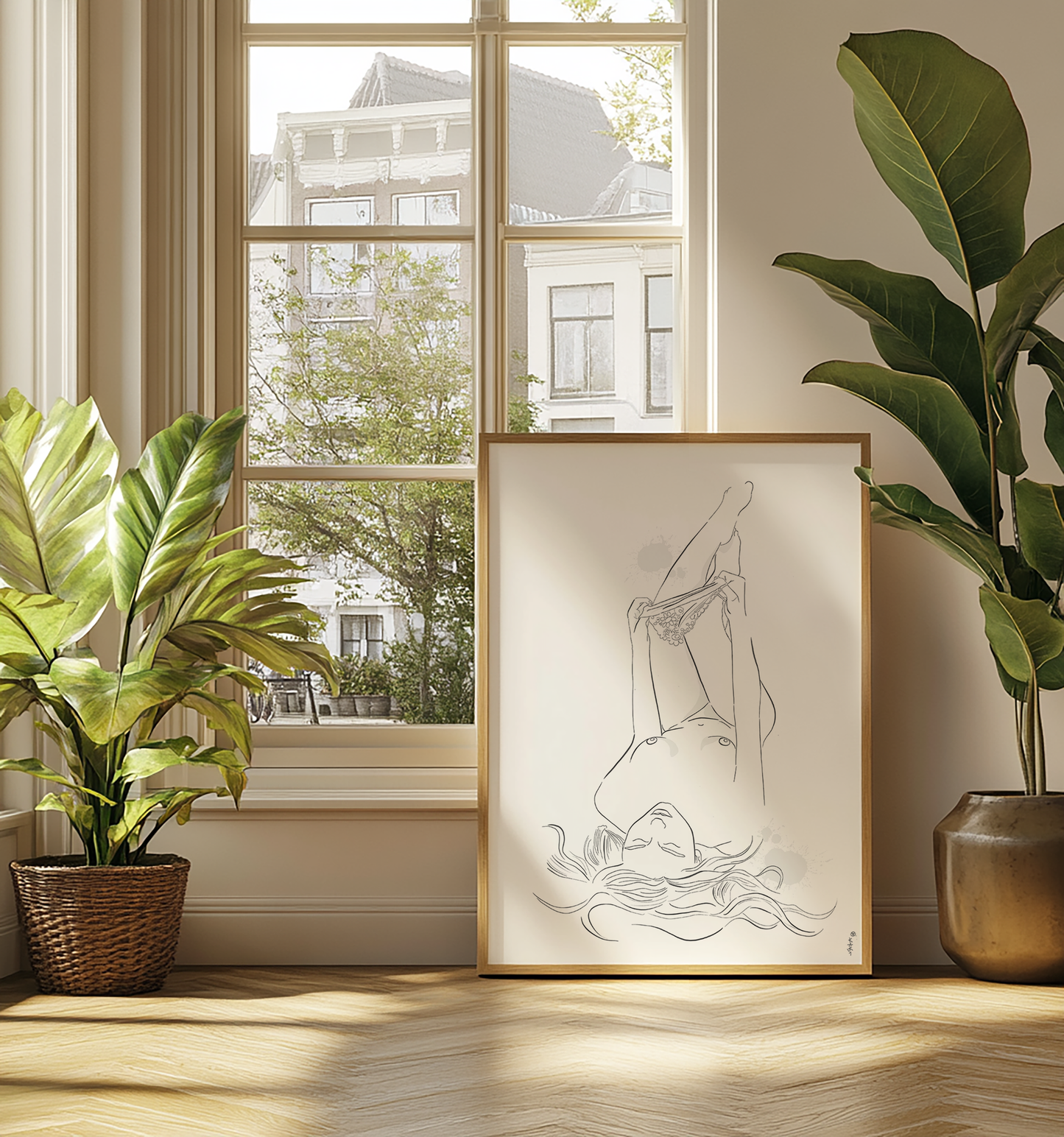 Mockup of an illustration of a nude woman undressing. This erotic art is placed in a natural color wooden frame and leans against a big window