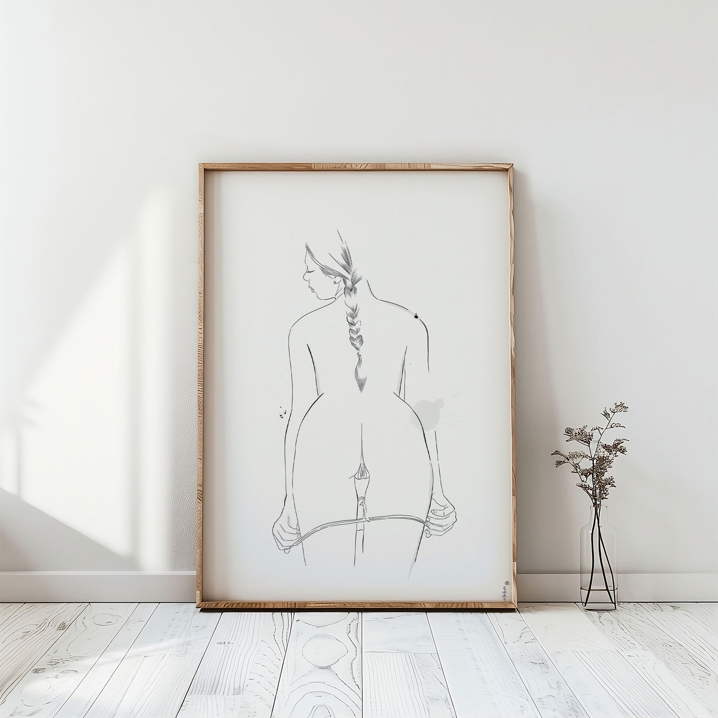 erotic line drawing in a frame mockup, emphasizing minimalist nude art in a digital downloadable format for immediate access to your erotica art. The artwork is placed on a white floor. 