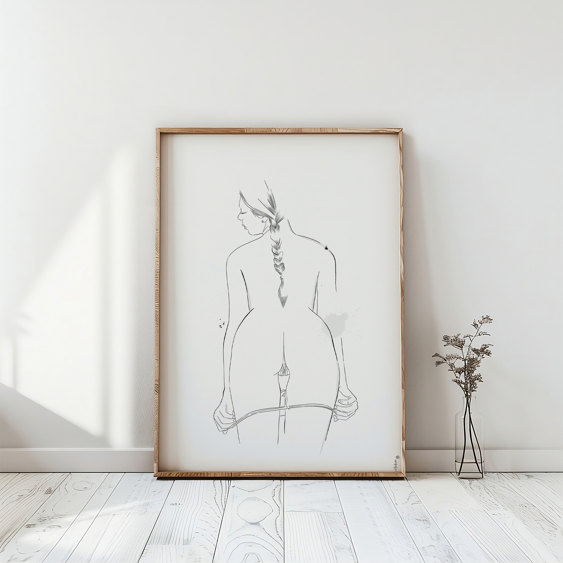 erotic line drawing in a frame mockup, emphasizing minimalist nude art in a digital downloadable format for immediate access to your erotica art. The artwork is placed on a white floor. 